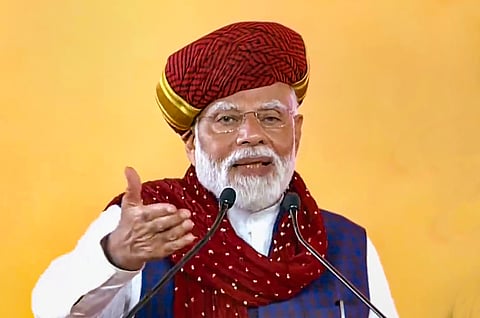 Prime Minister Narendra Modi speaks at the launch of development works, in Rajkot, Sunday, Feb. 25, 2024.