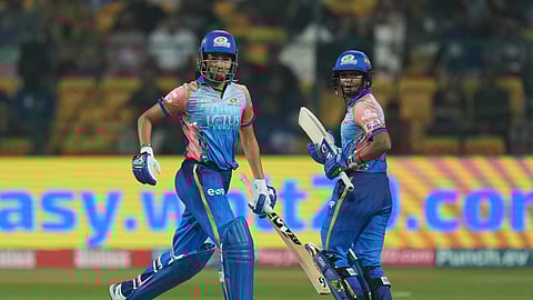 Mumbai Indians batters Yastika Bhatia and Harmanpreet Kaur run between the wickets during the WPL 2024 match between Delhi Capitals and Mumbai Indians, at the M Chinnaswamy Stadium in Bengaluru.