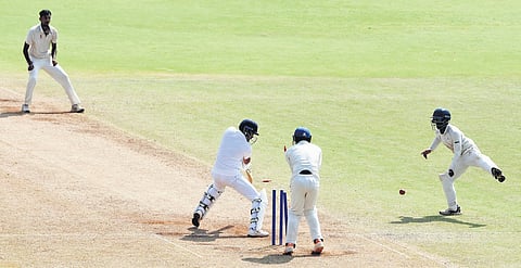 Tamil Nadu’s Ajith Ram takes a wicket against Karnataka on Sunday, Feb 11, 2024.