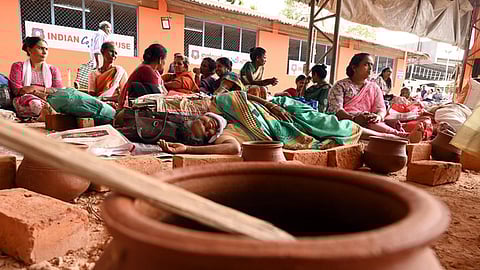 Women devotees who have come a day earlier for the Attukal pongala,
