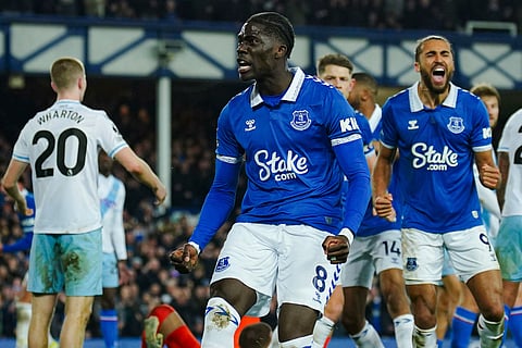 Everton's Amadou Onana, front, celebrates after scoring his side's first goal during the English Premier League match against Crystal Palace (Photo | AP)
