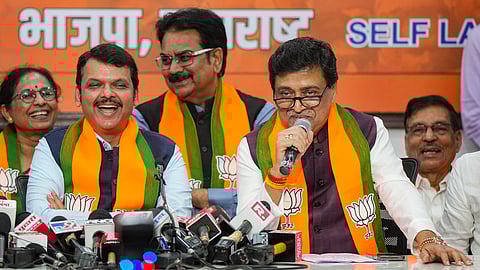 Former Maharashtra CM and Congress leader Ashok Chavan (R) with Maharashtra Deputy Chief Minister Devendra Fadnavis address the media after joining the BJP, in Mumbai, Tuesday, Feb. 13, 2024.