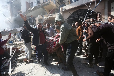Palestinians rescue survivors after an Israeli strike on Shaheen family house in Rafah, Gaza Strip, Saturday, Feb. 24, 2024.