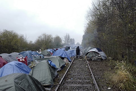 A migrants makeshift camp is set up in Calais, northern France, where migrants wait for the change to make a dash across the English Channel, Nov 27, 2021.