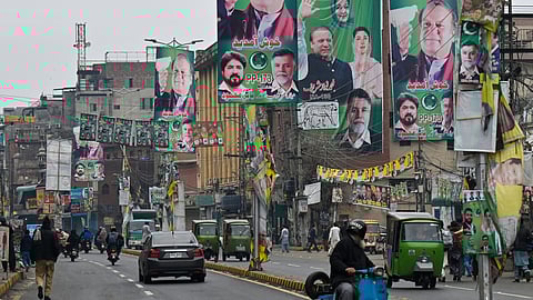 A street is festooned with posters of Pakistan's former Prime Minister and leader of the Pakistan Muslim League (PML) party, Nawaz Sharif, in Lahore on February 4, 2024, ahead of national elections.