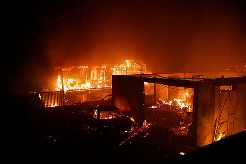 Vehicles and homes burn after a forest fire broke out in Viña del Mar, Chile, on February 2, 2024.