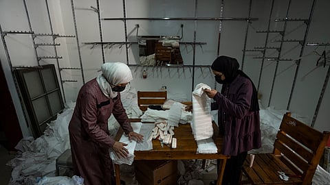 Palestinian women sew diapers in Rafah, southern Gaza Strip.
