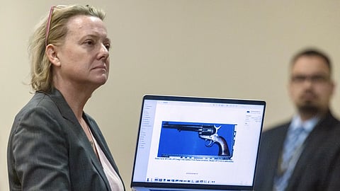 Special prosecutor Kari Morrissey shows defense attorney Jason Bowles a picture of firearm during Hannah Gutierrez-Reed trial at District Court, Feb 26, 2024.
