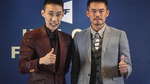 Malaysia's former world number one badminton player Lee Chong Wei (L) and old rival Lin Dan