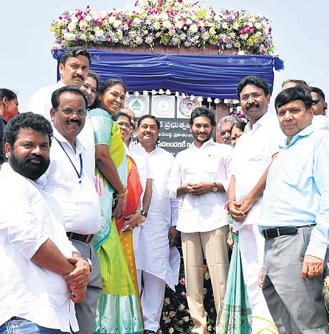 Andhra Pradesh CM YS Jagan Mohan Reddy during the launch of the distribution of registered conveyance deeds of house sites to beneficiaries on Friday