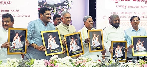 CM Siddaramaiah, Council Chairman Basavaraj Horatti, and others unveil the portrait of Basavanna in Vidhana Soudha on Tuesday.