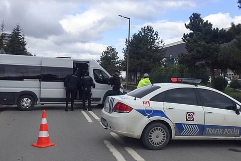 Police officers block a road outside the Procter & Gamble factory near Gebze, northwest Turkey, Thursday, Feb 1, 2024.