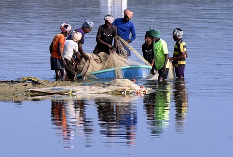A group of fishermen getting ready to go fishing.