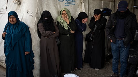 Palestinians mourn relatives killed in the Israeli bombardment in Rafah, Gaza Strip.