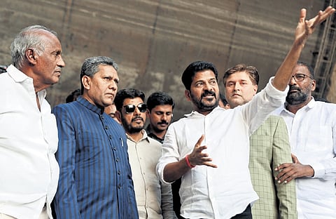 Chief Minister A Revanth Reddy, ministers and legislators inspect the damages to the Medigadda barrage on Tuesday. A crack on the barrage (right)
