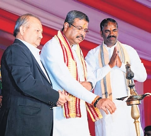 Union Minister of Education and Skill Development Dharmendra Pradhan lighting a lamp at Chhendipada