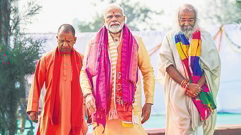 PM Narendra Modi with UP CM Yogi Adityanath and Acharya Pramod Krishnan during foundation stone laying ceremony of Shri Kalki Dham in Sambhal on Monday.