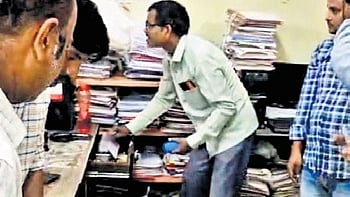 Court staff seize material from the Mancherial RDO office on Wednesday