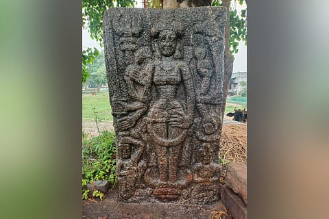 Adjacent to Kotravai are symbols of a trishul on her right and a deer on her left.