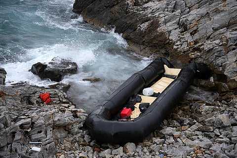 A dinghy lies on the shore after a shipwreck where two migrants were killed and eight were rescued, in Thermi, on the northeastern Aegean Sea island of Lesbos, Greece.