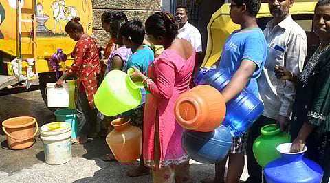 People line up to get drinking water from a water tanker in Bengaluru (File Photo | Express)