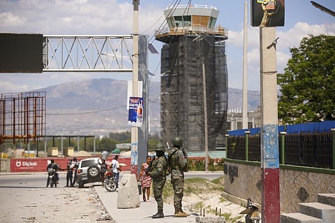 Soldiers guard the entrance of the international airport in Port-au-Prince, Haiti, Monday, March 4, 2024.