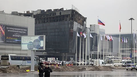 Police officers secure an area near the Crocus City Hall on the western edge of Moscow, Russia on Saturday.