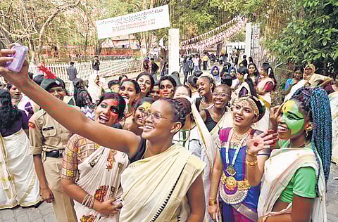 Students of Government College for Women, hailing from African countries and dressed in traditional attire, posing with local students during the procession preceding the inauguration of Kerala University Youth Festival in capital on Thursday