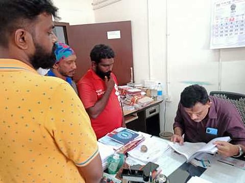 Gig workers submitting a complaint to the district labour officer (File photo)