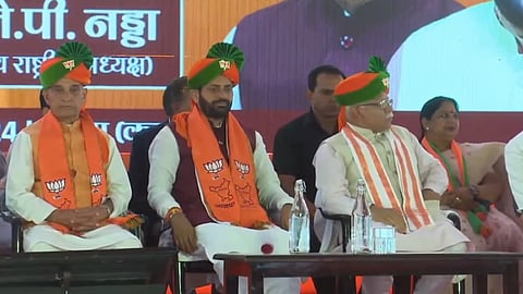 Haryana Chief Minister Nayab Singh Saini (C) with his predecessor Manohar Lal Khattar (R) at the cabinet expansion ceremony on Tuesday.