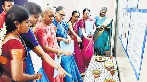 Colourful charts detailing the types of millet, the history of these protein-rich grains, and their benefits are displayed on the walls.