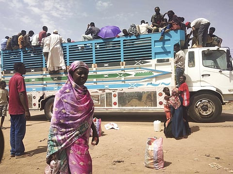 People board a bus as they leave Khartoum, Sudan on June 19, 2023.