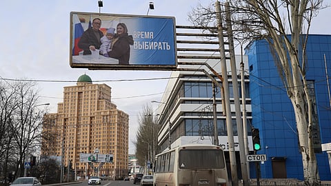 A billboard which promotes the upcoming presidential election with words in Russian: "Time to vote" is seen in a street in Donetsk of Russian-controlled Donetsk region, eastern Ukraine.
