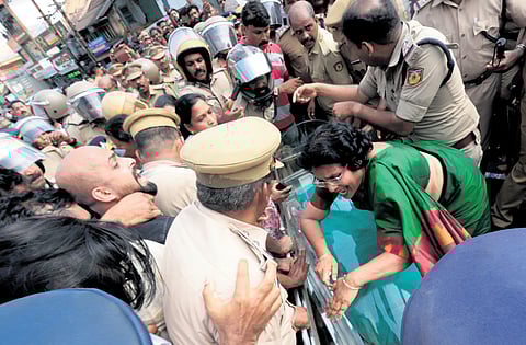 UDF workers and residents stage a protest carrying the body of Indira in Kothamangalam on Monday