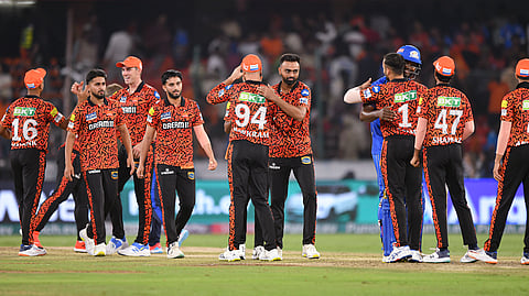Sunrisers Hyderabad players celebrate after winning the IPL T20 cricket match over Mumbai Indians, at Rajiv Gandhi International Cricket Stadium, in Hyderabad.