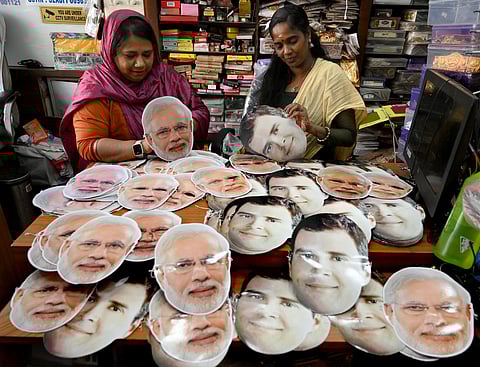 Shopkeepers arranging the facemasks with the photos of Narendra Modi and Rahul Gandhi for sales ahead of Lok Sabha election campaign.