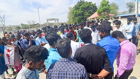 Students protesting in front of the university over alleged irregularities in semester results