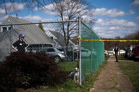 Police work a scene on Viewpoint Lane after An "extremely dangerous" suspect allegedly shot dead three family members.