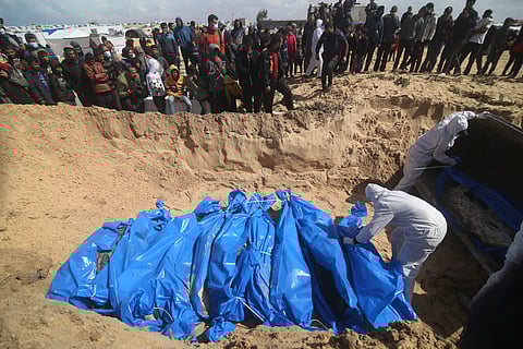 Palestinians attend a mass funeral of people killed in the Israeli offensive on Khan Younis in Rafah, Gaza Strip.