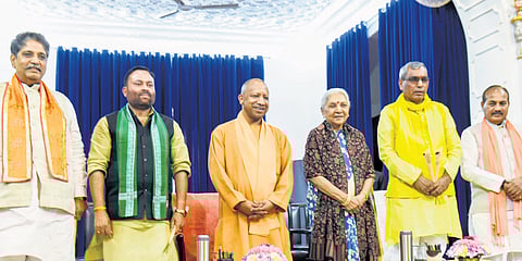 UP Governor Anandiben Patel with CM Yogi Adityanath and newly sworn-in cabinet ministers at Raj Bhavan, in Lucknow on Tuesday.