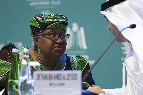 WTO Director-General Ngozi Okonjo -Iweala talks to Emirati Minister of State for Foreign Trade Thani Bin Ahmed al-Zeyoudi on stage at the WTO summit in Abu Dhabi, Feb 26, 2024.