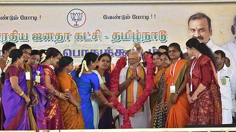 Prime Minister Narendra Modi being garlanded at a public meeting ahead of Lok Sabha elections, in Kanyakumari, Friday, March 15, 2024.