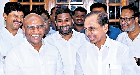 A file photograph of BRS chief K Chandrasekhar Rao sharing a lighter moment with RS Praveen Kumar earlier in March when the alliance with the BSP was announced