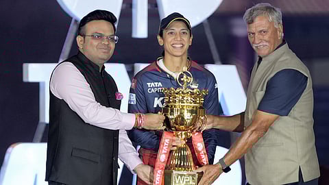 RCB captain Smriti Mandhana receives the Champions trophy from BCCI President Roger Binny and BCCI Secretary Jay Shah after the WPL-T20 final cricket match between Delhi Capitals and Royal Challengers Bangalore on March 17, 2024.