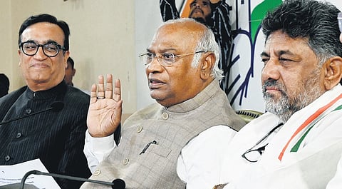 AICC president Mallikarjun Kharge with DCM D K Shivakumar and Rajya Sabha member Ajay Maken at the KPCC office in Bengaluru on Friday