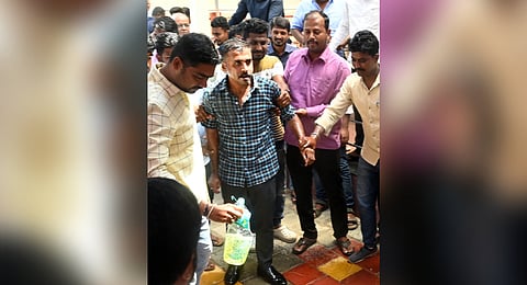 A BJP worker tried to immolate himself during a protest in Davanagere on Thursday.