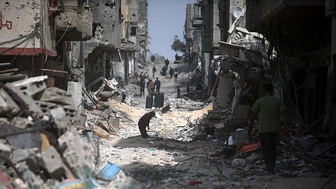 Palestinians visit their destroyed homes after Israeli forces left Khan Younis, Gaza Strip.