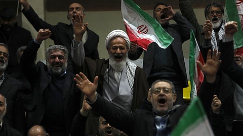 Supporters of a group of candidates chant slogans during their election campaign rally ahead of the March 1, parliamentary and Assembly of Experts elections, in Tehran.