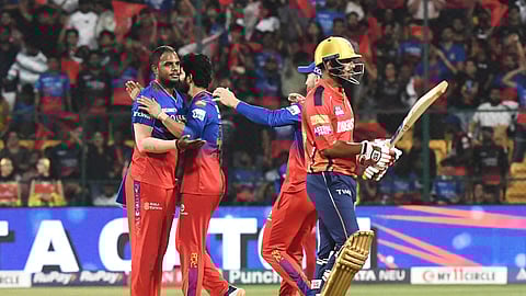 Royal Challengers Bengaluru bowler Yash Dayal with teammates during the Indian Premier League (IPL) 2024 T20 cricket match between Royal Challengers Bangalore and Punjab Kings at M Chinnaswamy Stadium, in Bengaluru
