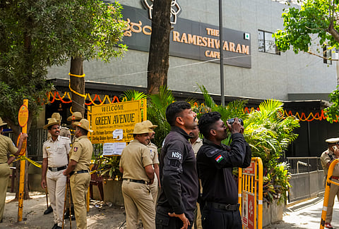 Security personnel stand guard at the Rameshwaram cafe blast site, in Bengaluru